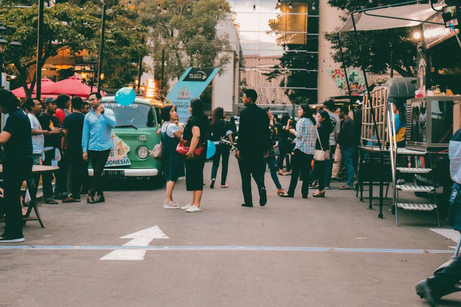 Food trucks gathered for an outdoor community food event
