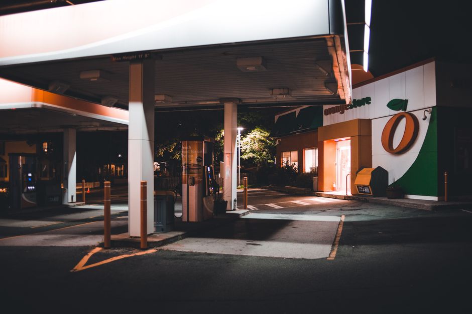 Exterior of a gas station convenience store at night