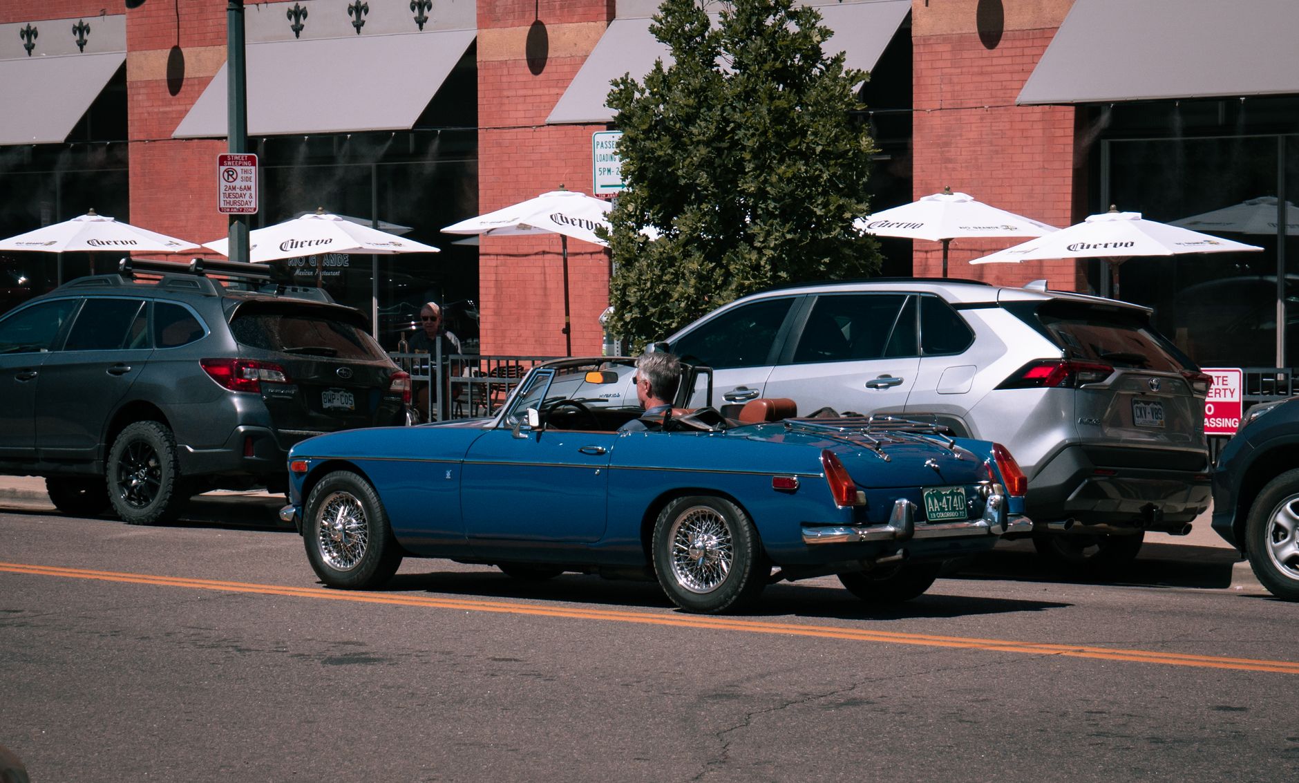 Cars parked along a historic downtown street