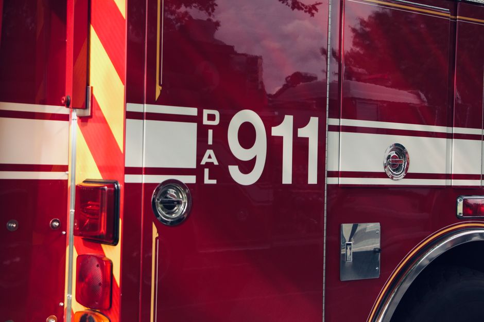 Firefighters and fire trucks at a fire station