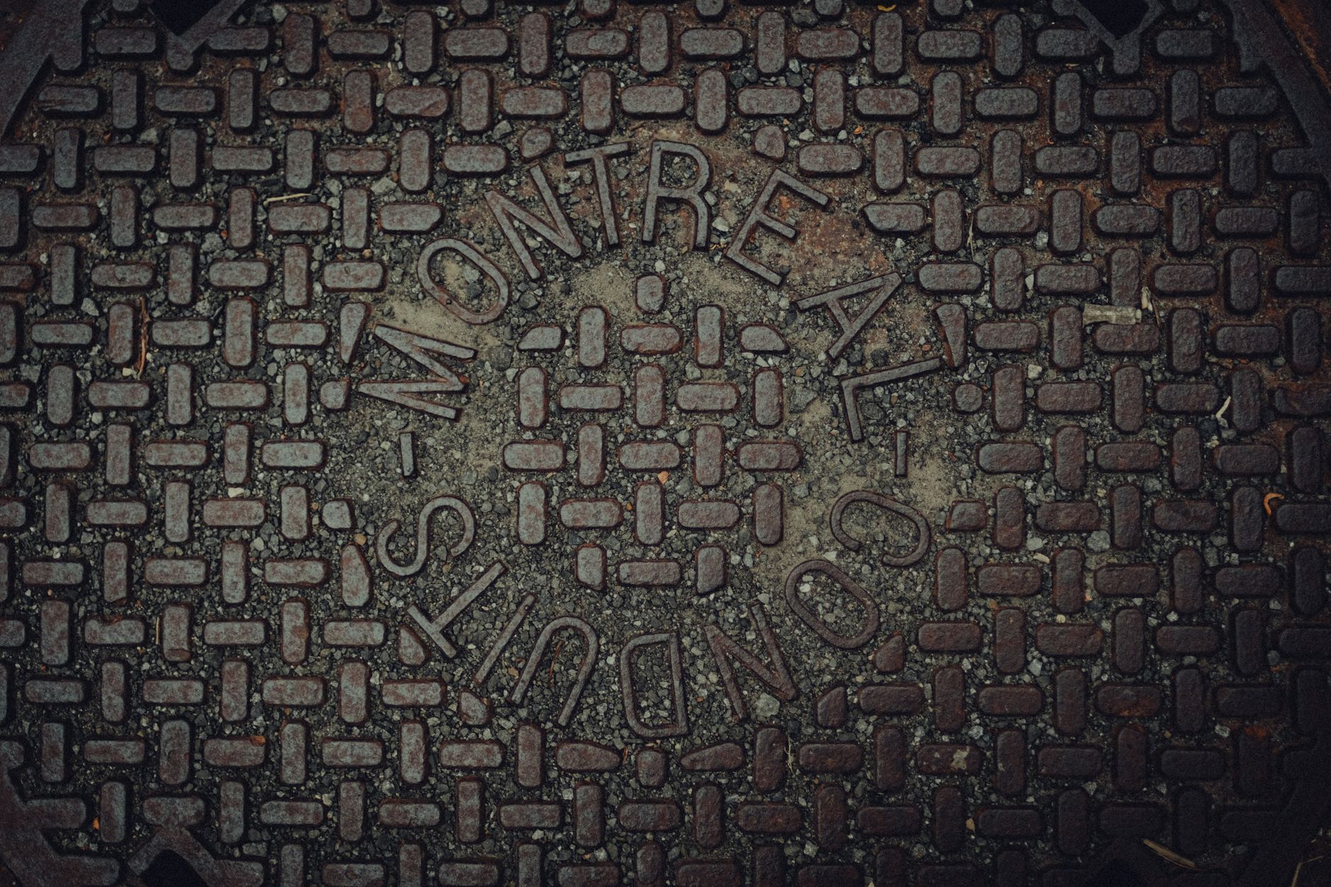 Cast iron manhole cover set in a city street