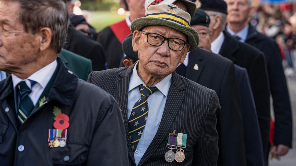 Elderly Navy veteran reflecting on wartime service