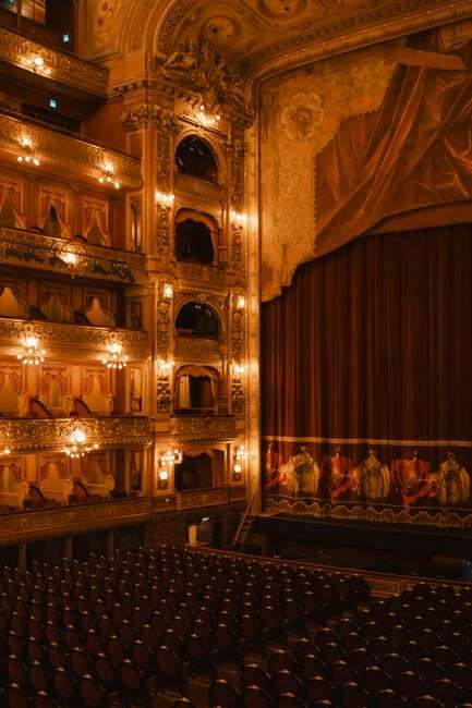 Stage lights illuminate a theater performance