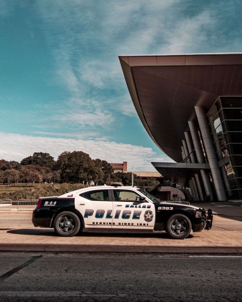 Generic marked police patrol car parked outdoors during daytime