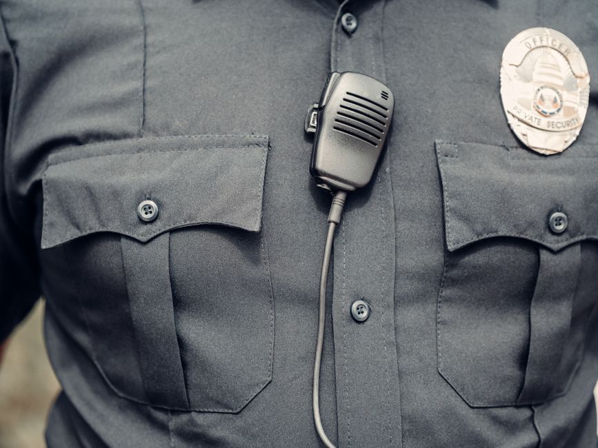 Police officer wearing a body camera on uniform