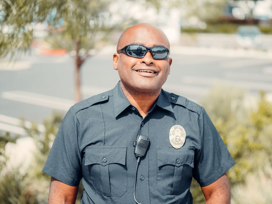 Police officer helping a person in need in a South Alabama community