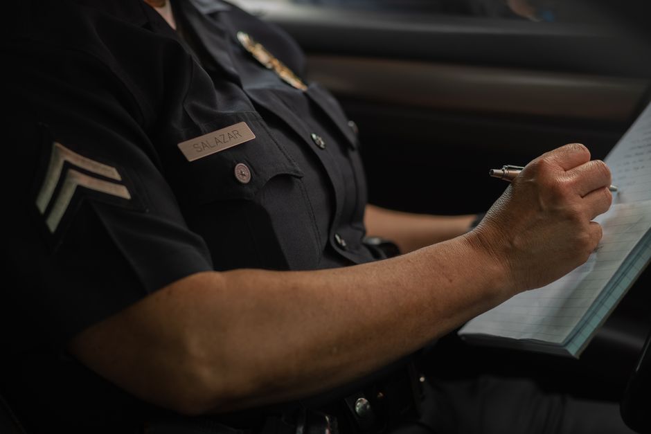 A police badge symbolizing an active search for a wanted suspect