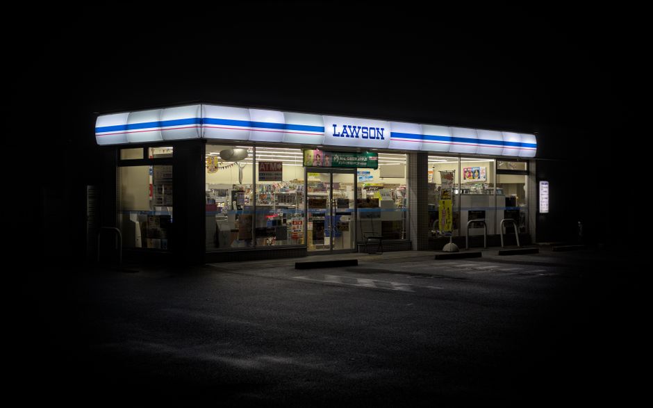 Convenience store parking lot lit at night