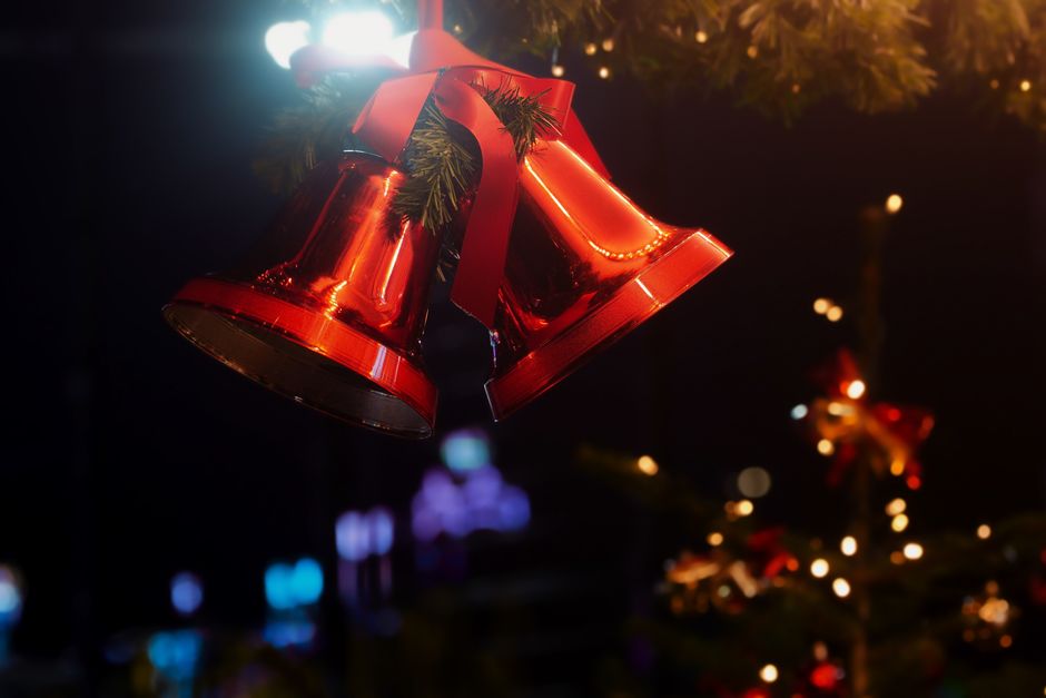 A Salvation Army Red Kettle and bell ringer collecting holiday donations