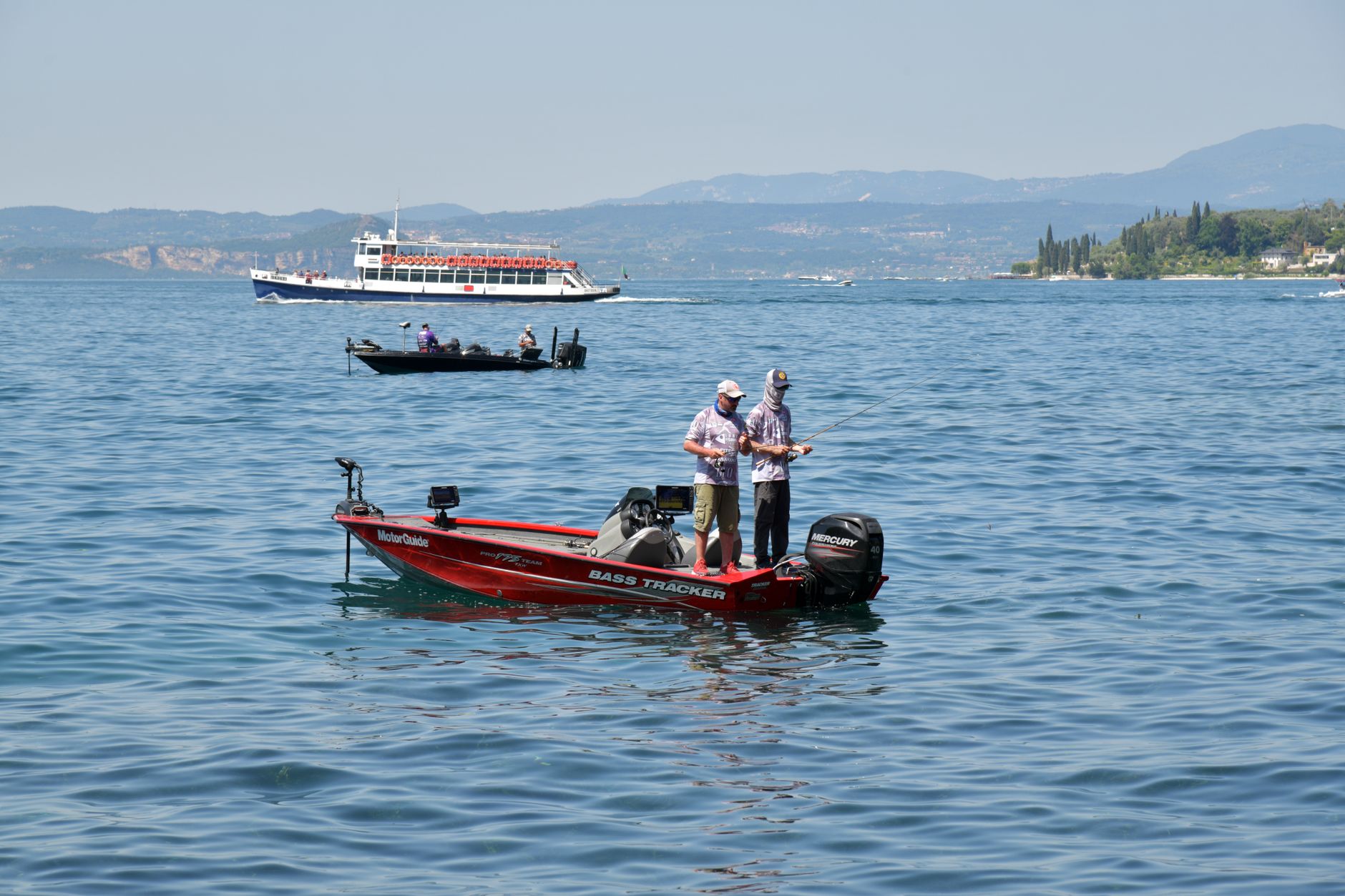 An angler in a bass boat on open water