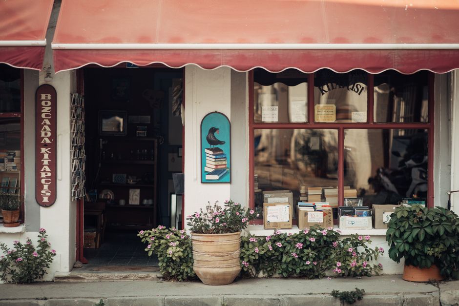A small-town bookstore storefront on a historic town square