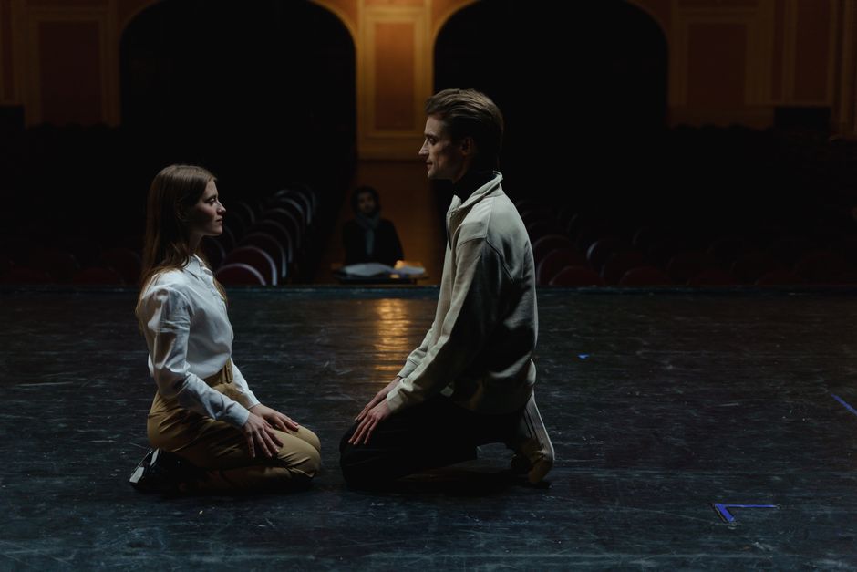 Students perform on a stage during a school theater production