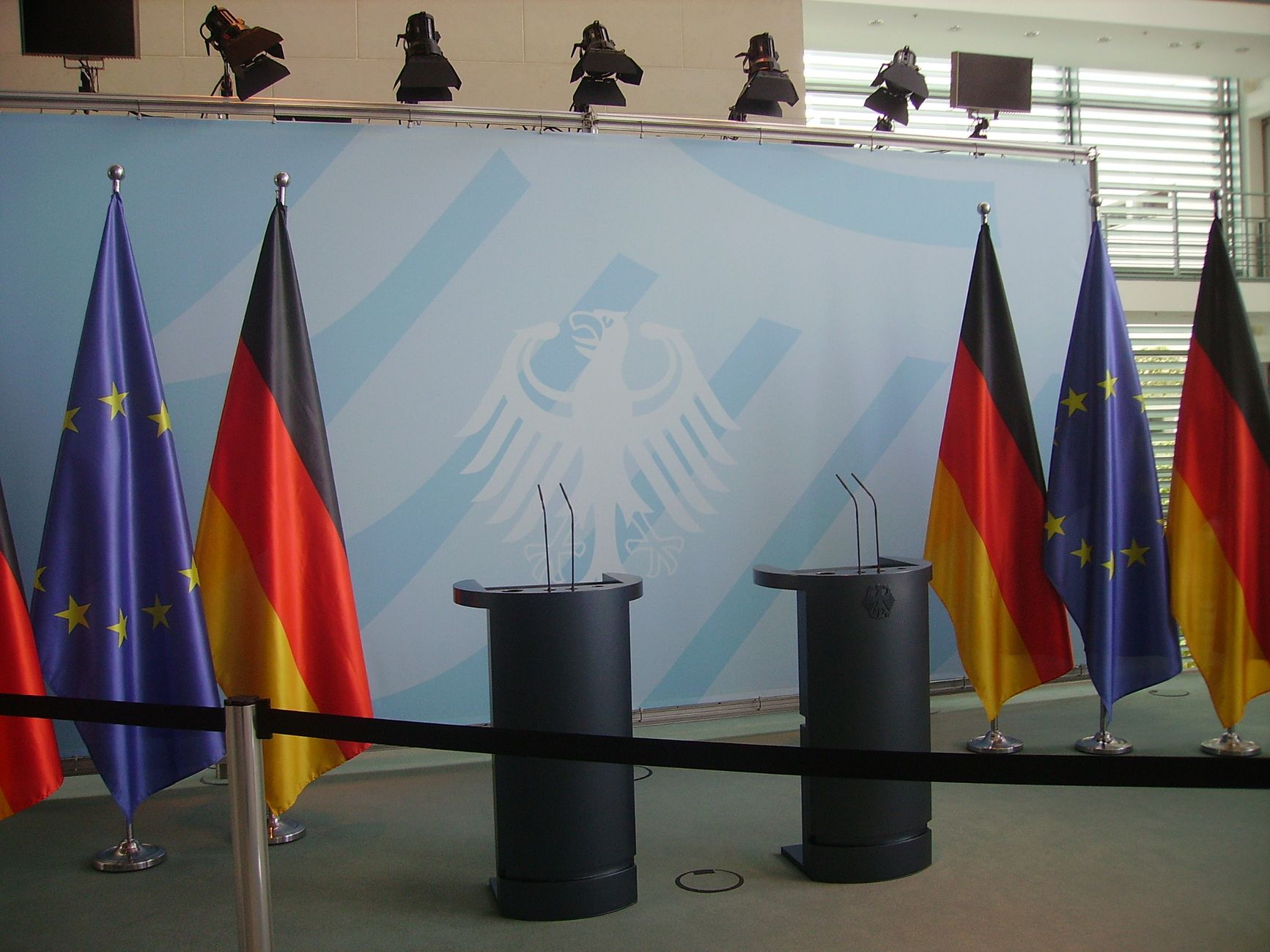 A podium with microphones at a political news conference