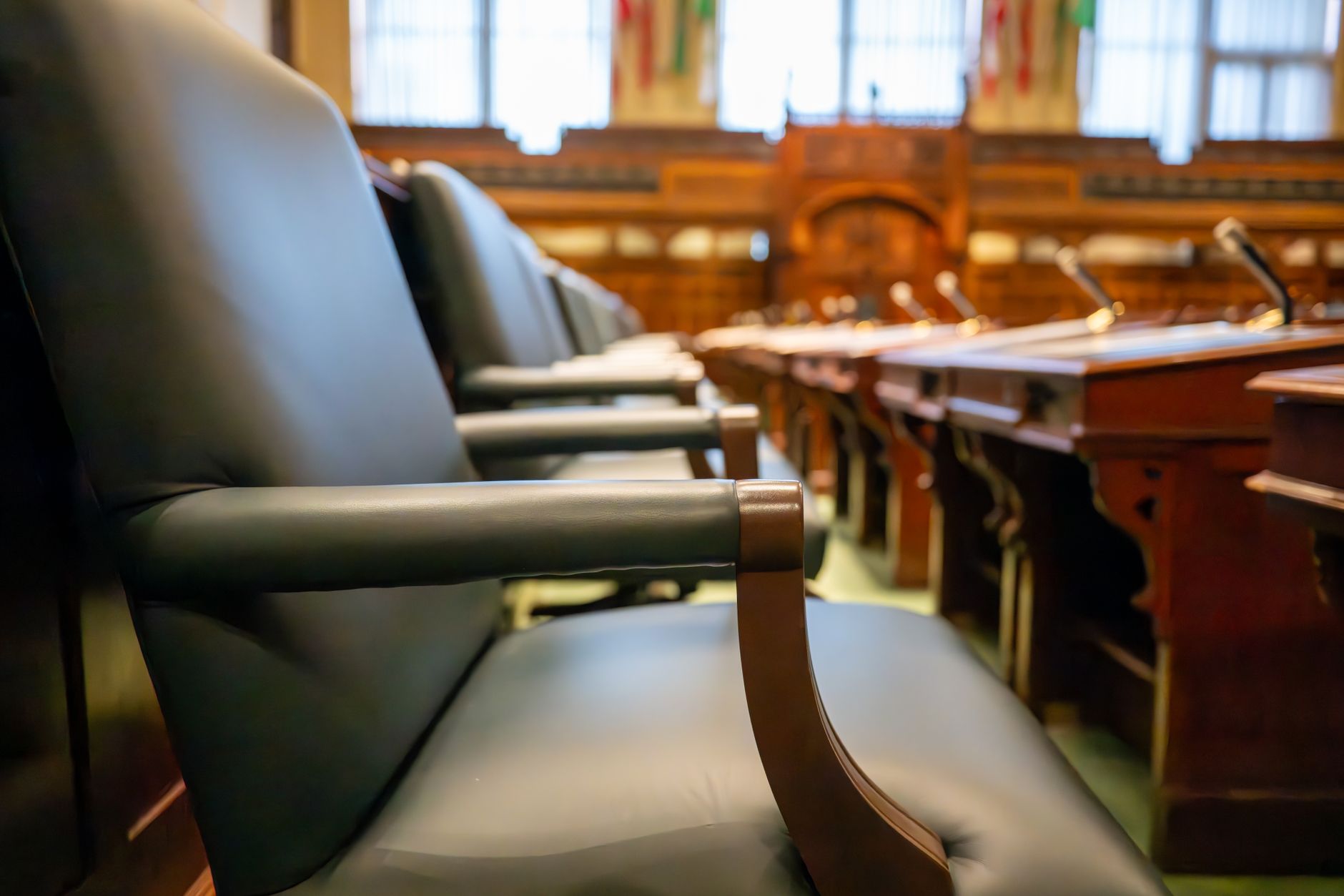 An empty seat in a government meeting room