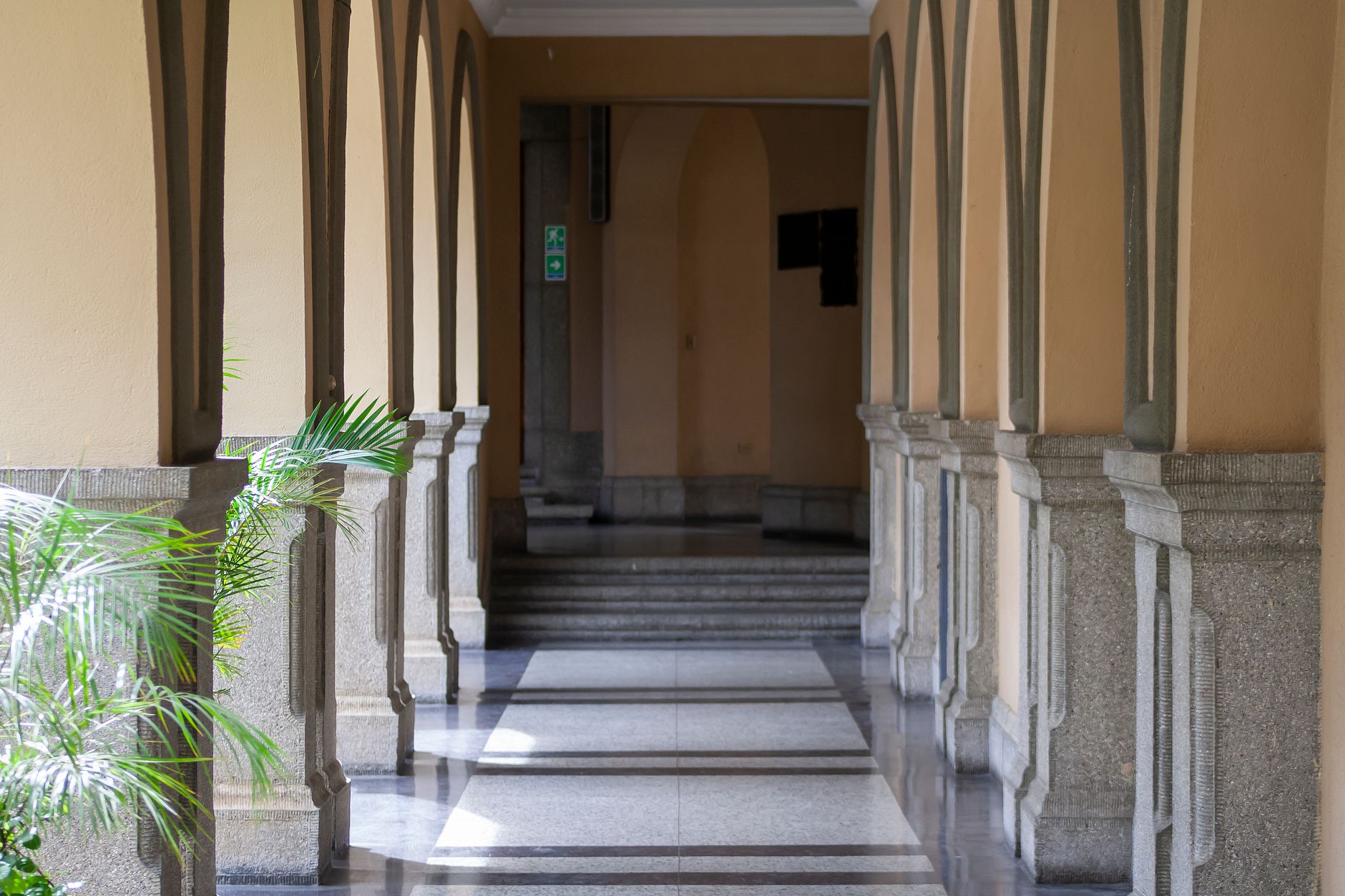 Columned courthouse corridor representing the Mobile County legal proceedings