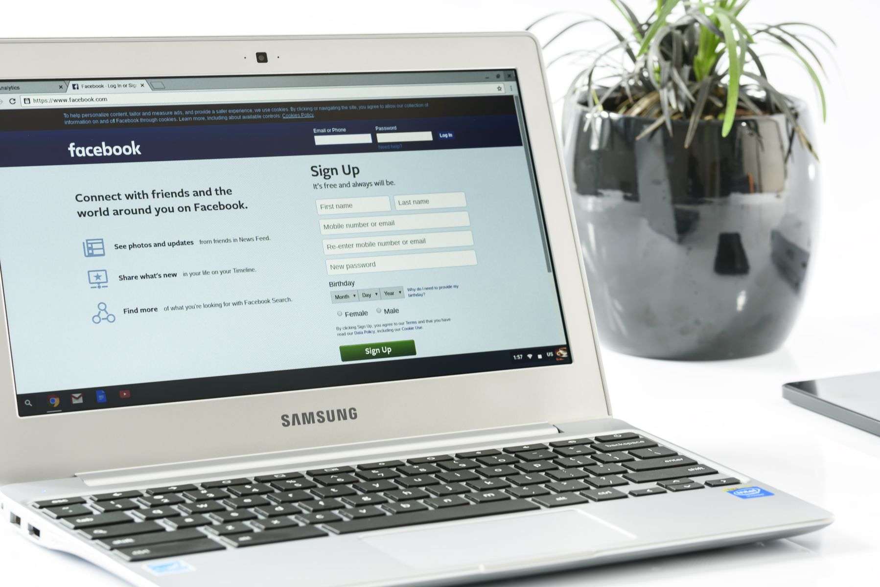 Person browsing a social networking site on a laptop, representing online grassroots activism
