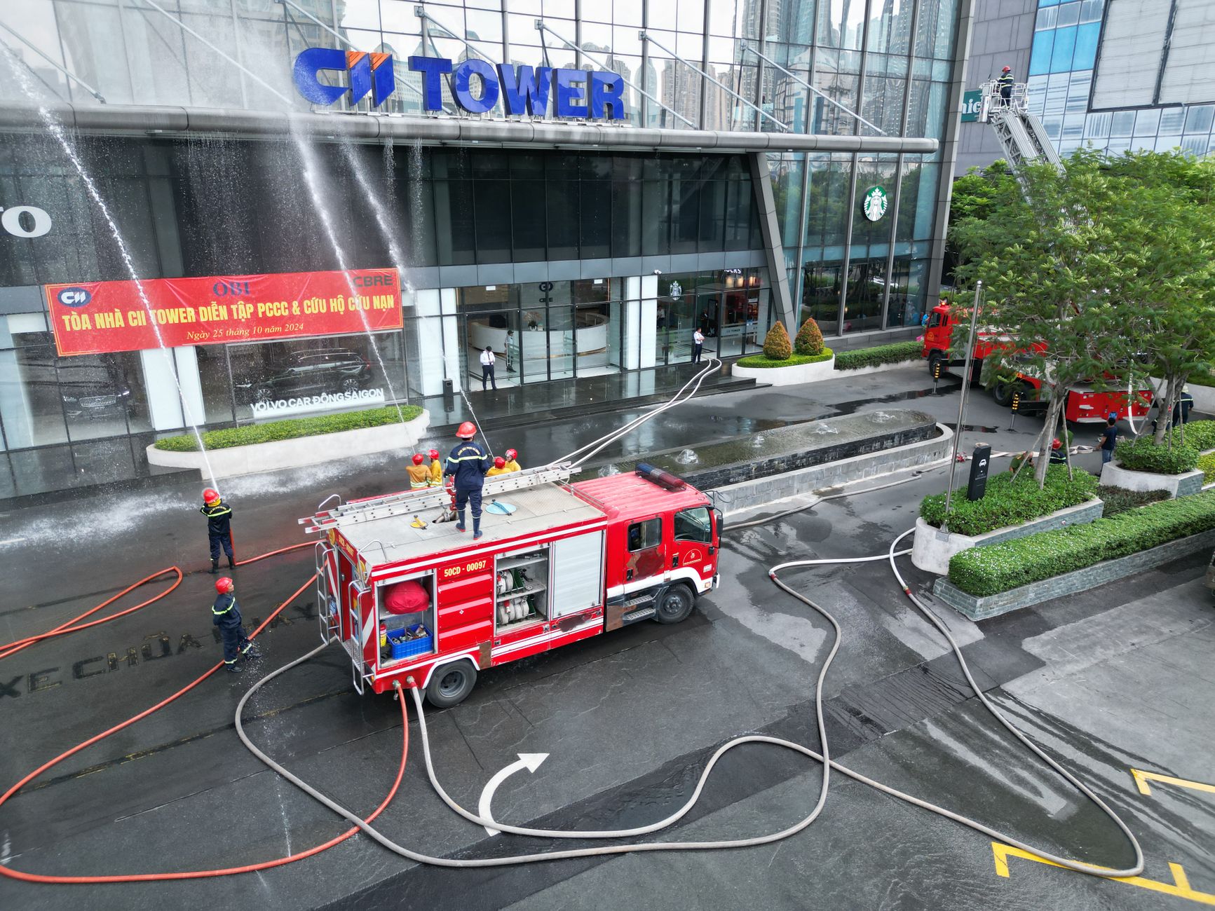 Firefighters conducting a live training drill at a burn tower