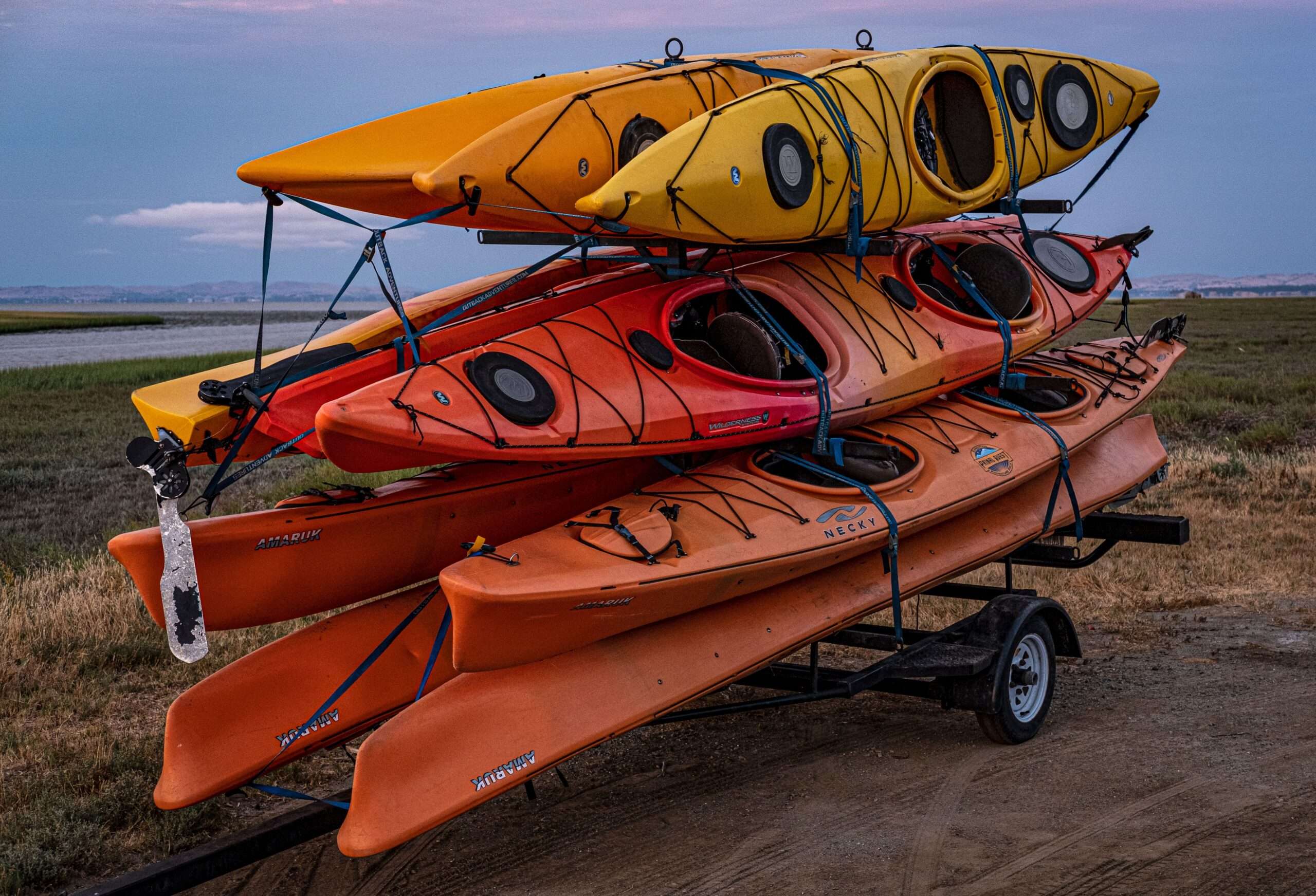 Kayak launch dock on calm water near a boat ramp