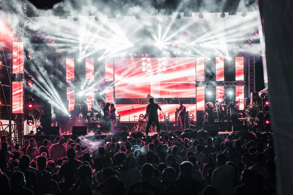 A band performs on stage at a Mobile music festival