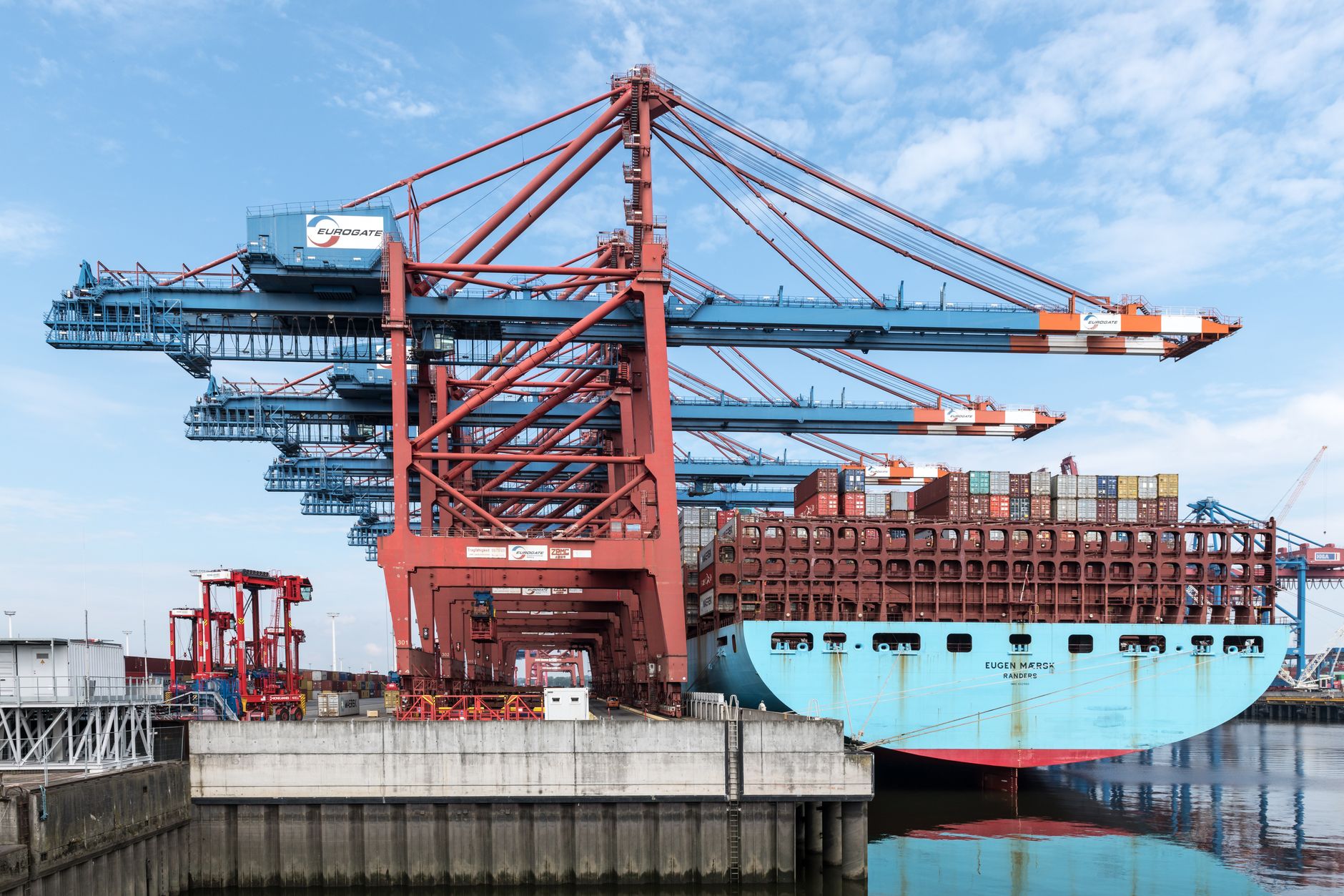 Large ship-to-shore cranes at a steel-handling port terminal