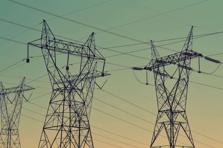 Electric power transmission lines against the sky