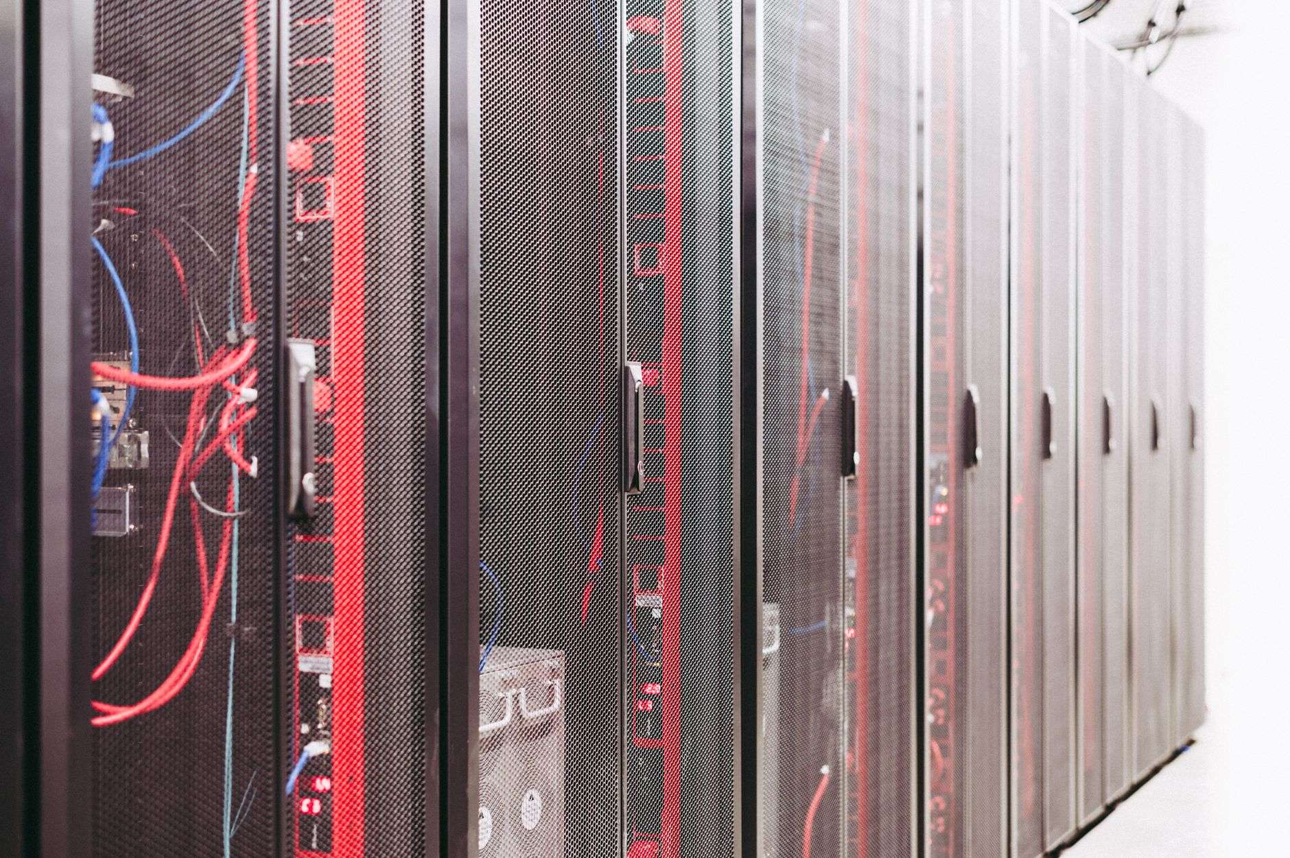 Rows of illuminated server racks inside a data center, representing the type of facility proposed for Prichard, Alabama