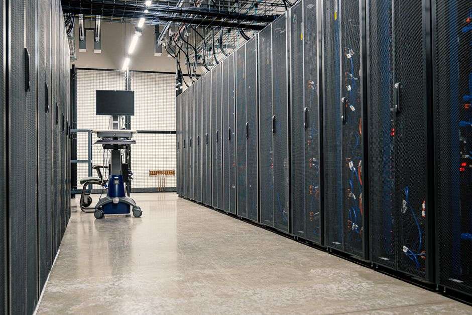 Rows of server racks inside a data center facility
