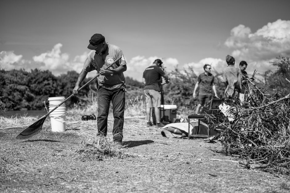 Volunteers clearing land in Prichard for a memorial park