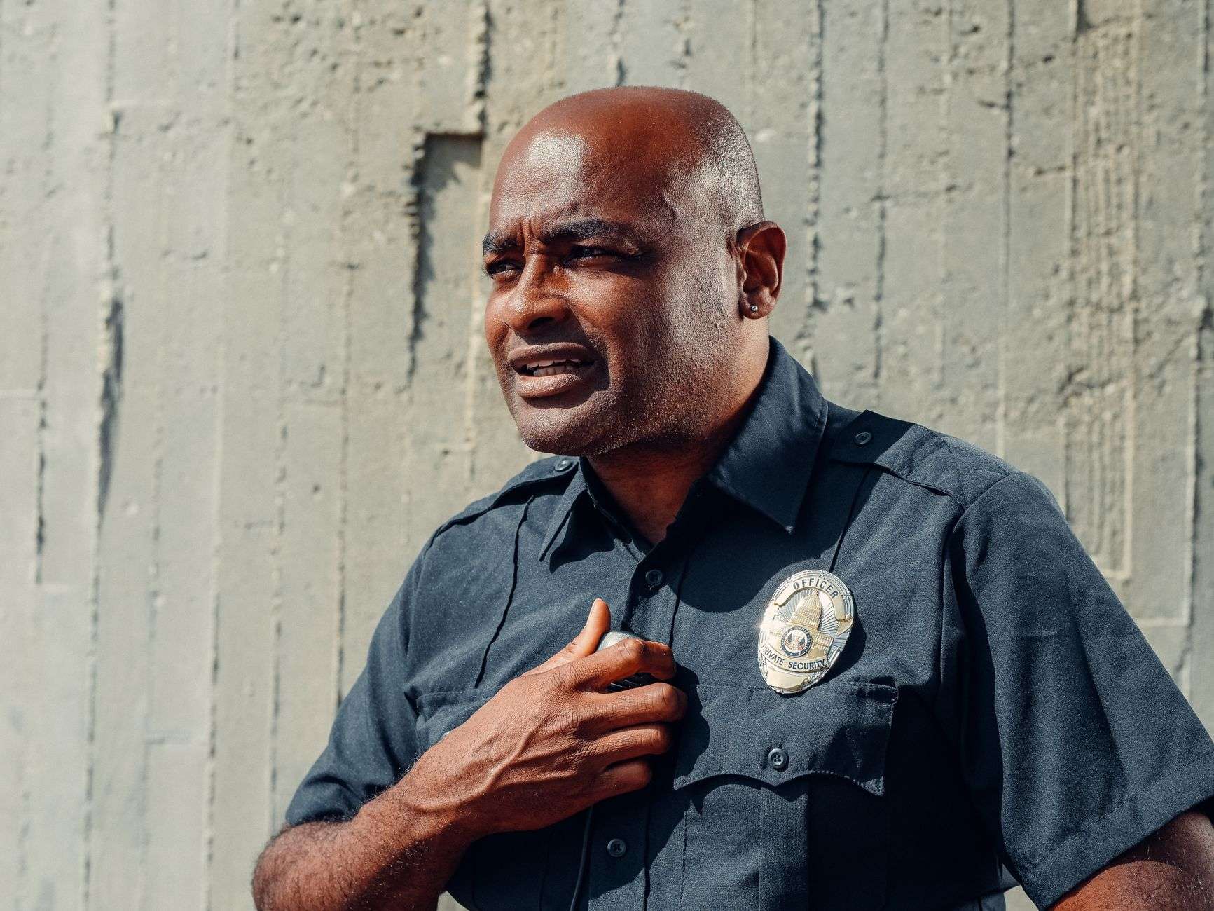 Police officer in uniform standing outdoors