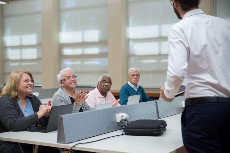 Adults participating in a workforce training classroom session