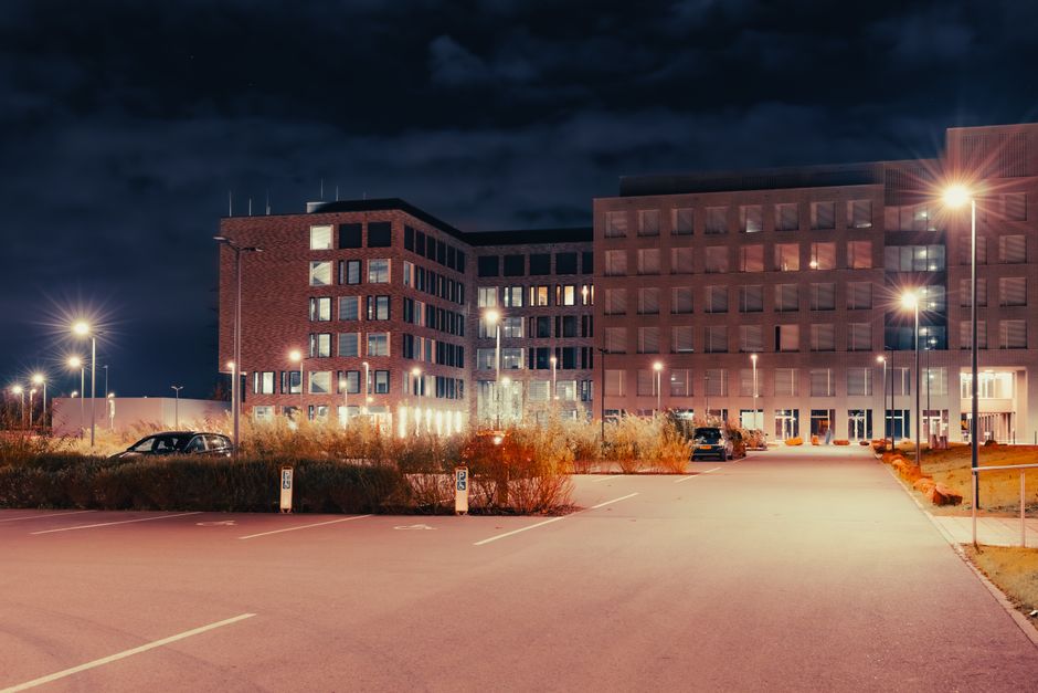 A parking area near a university campus at night