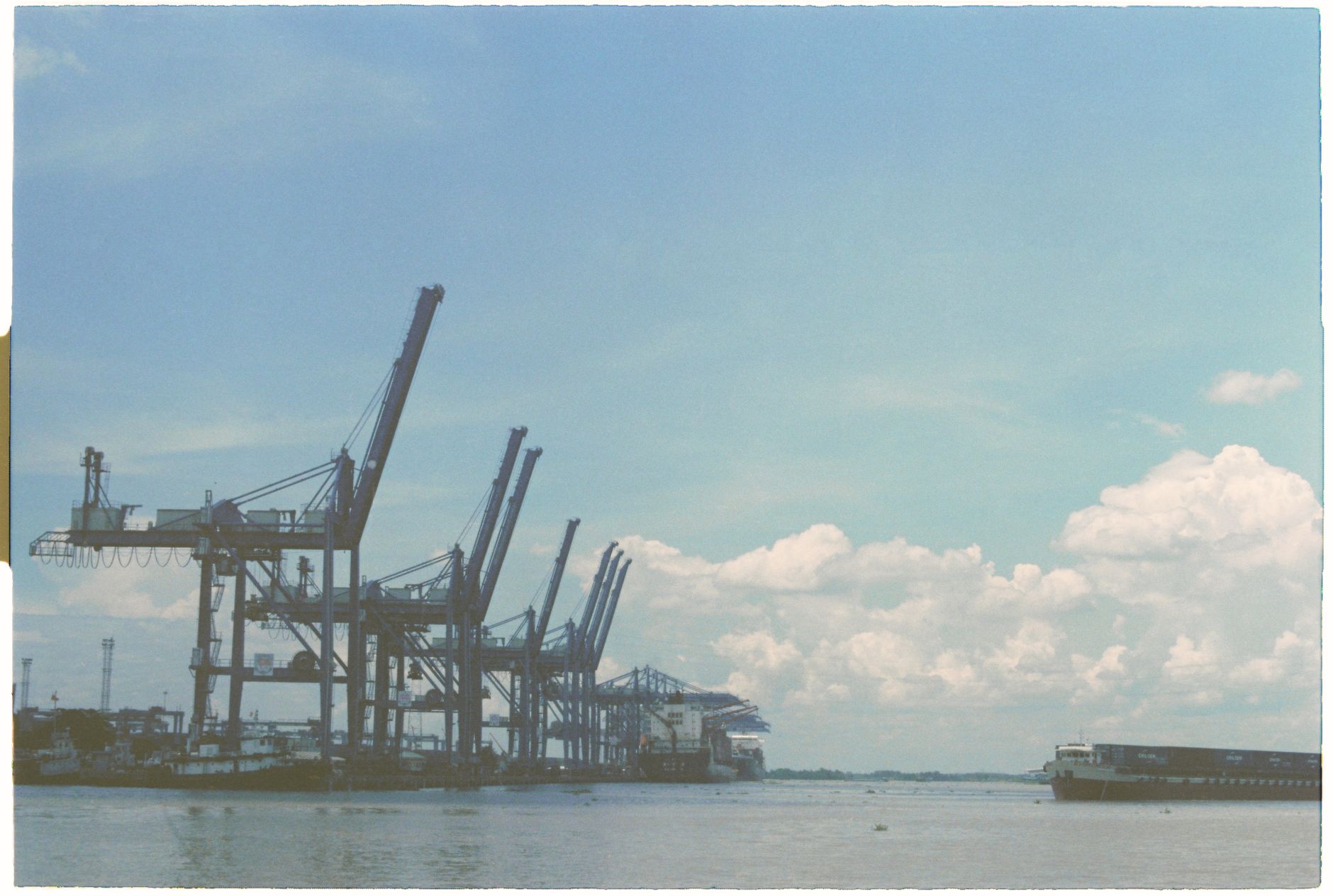 Container cranes and cargo terminals along a working river port