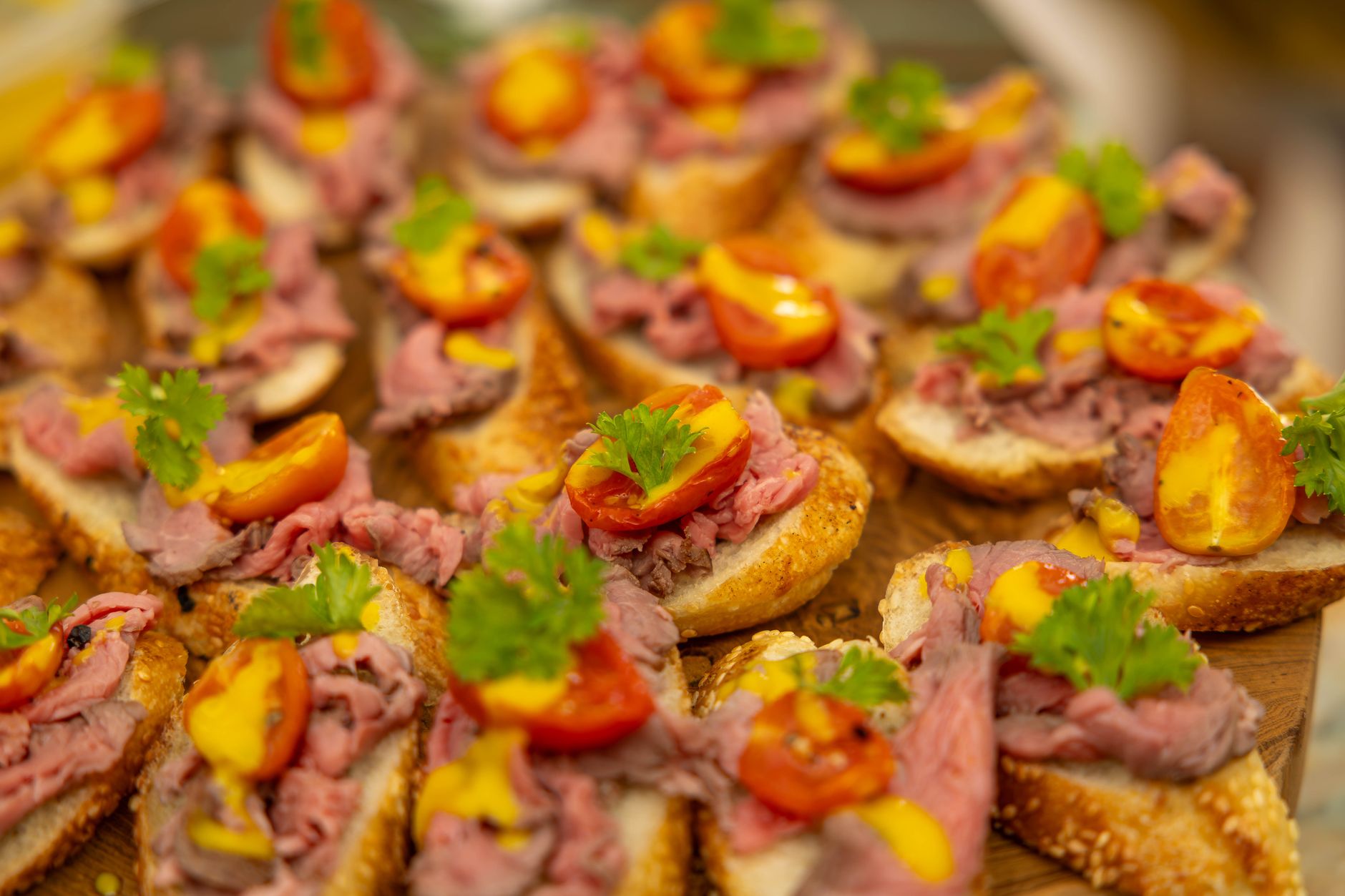 A roast beef po-boy on French bread, dressed with lettuce and tomato