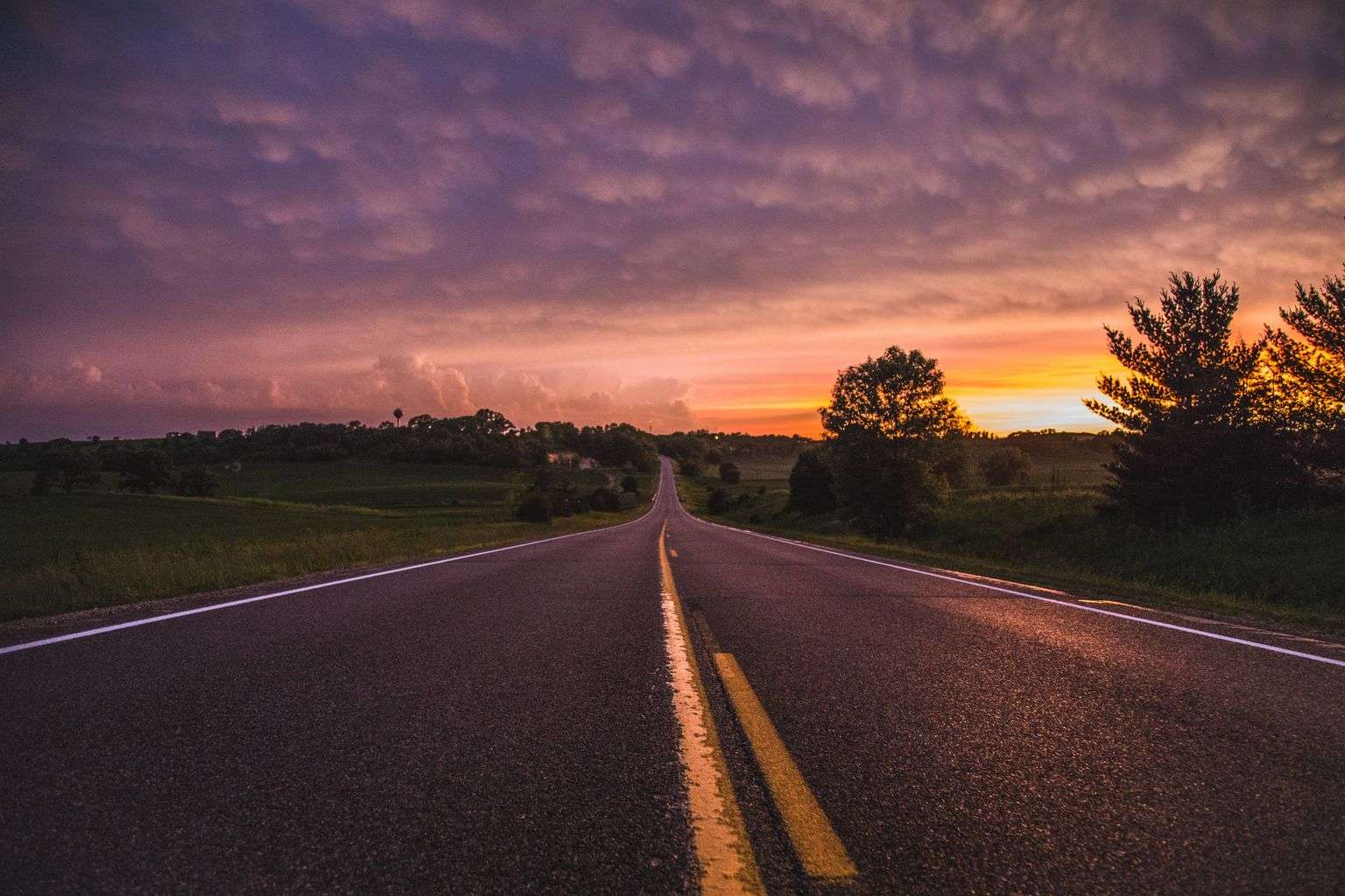 A quiet two-lane rural highway in Alabama photographed in the early morning light