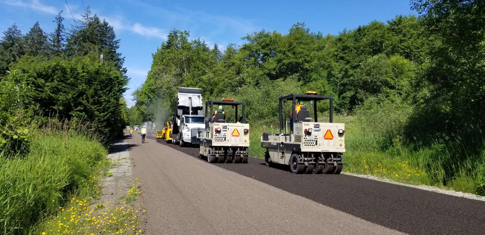 A rural two-lane road being paved in South Alabama