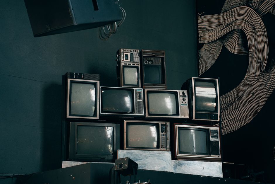Stack of old televisions like those in the Satsuma schools television sale