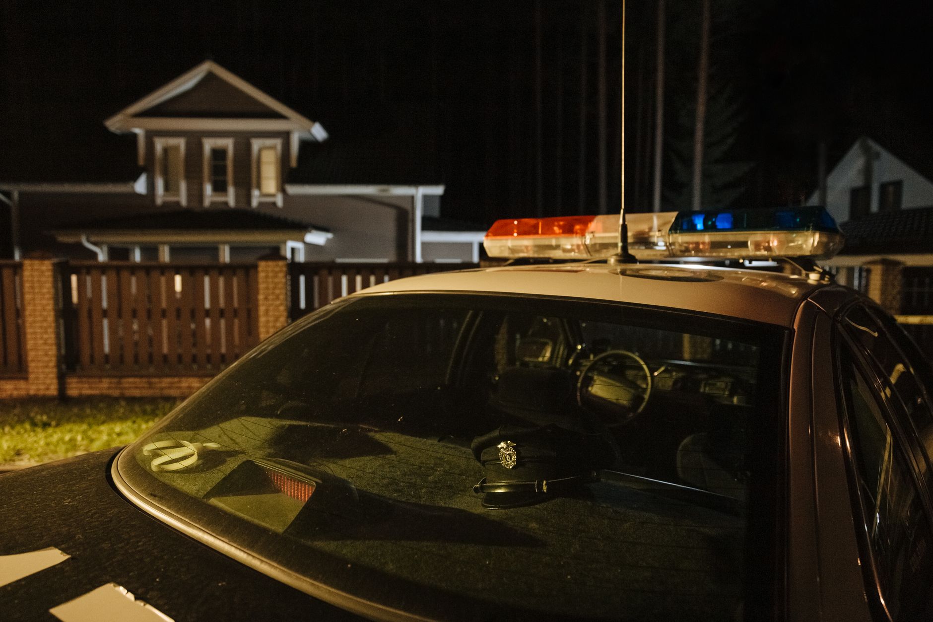 Police emergency lights in a residential neighborhood, illustrating a Mobile Police Department domestic violence response on Schimps Lane