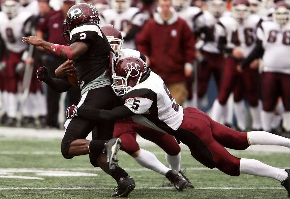 A defensive lineman battles at the line of scrimmage during a football game