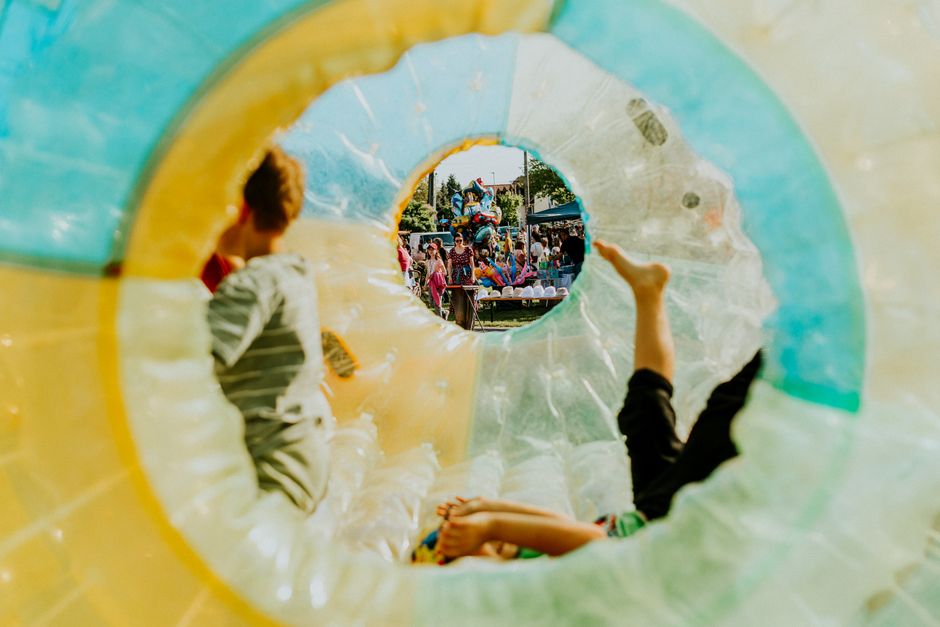 Giant inflatable water slide set up on a city street for a community event
