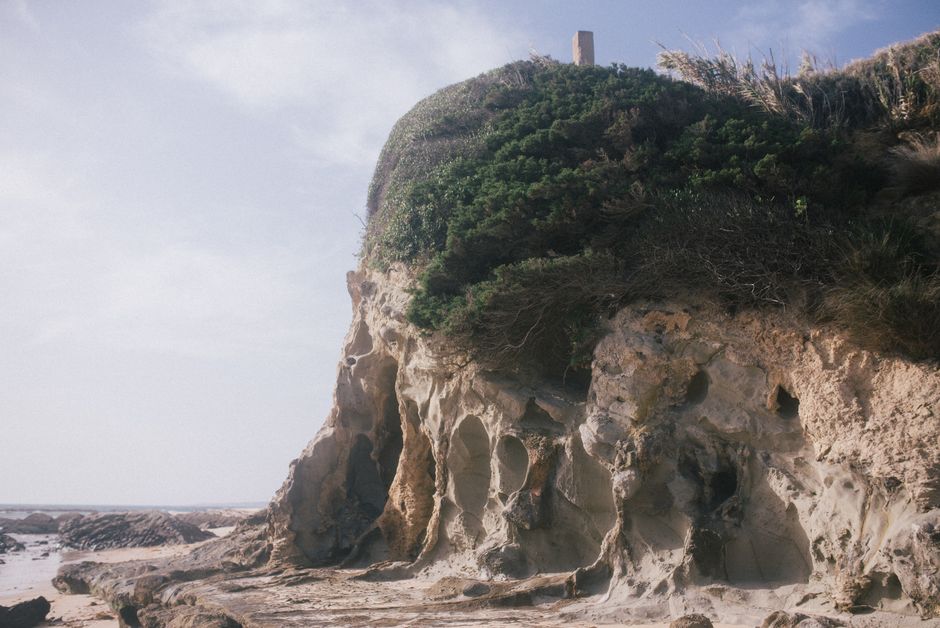 Concrete slope construction along an eroded coastal bluff