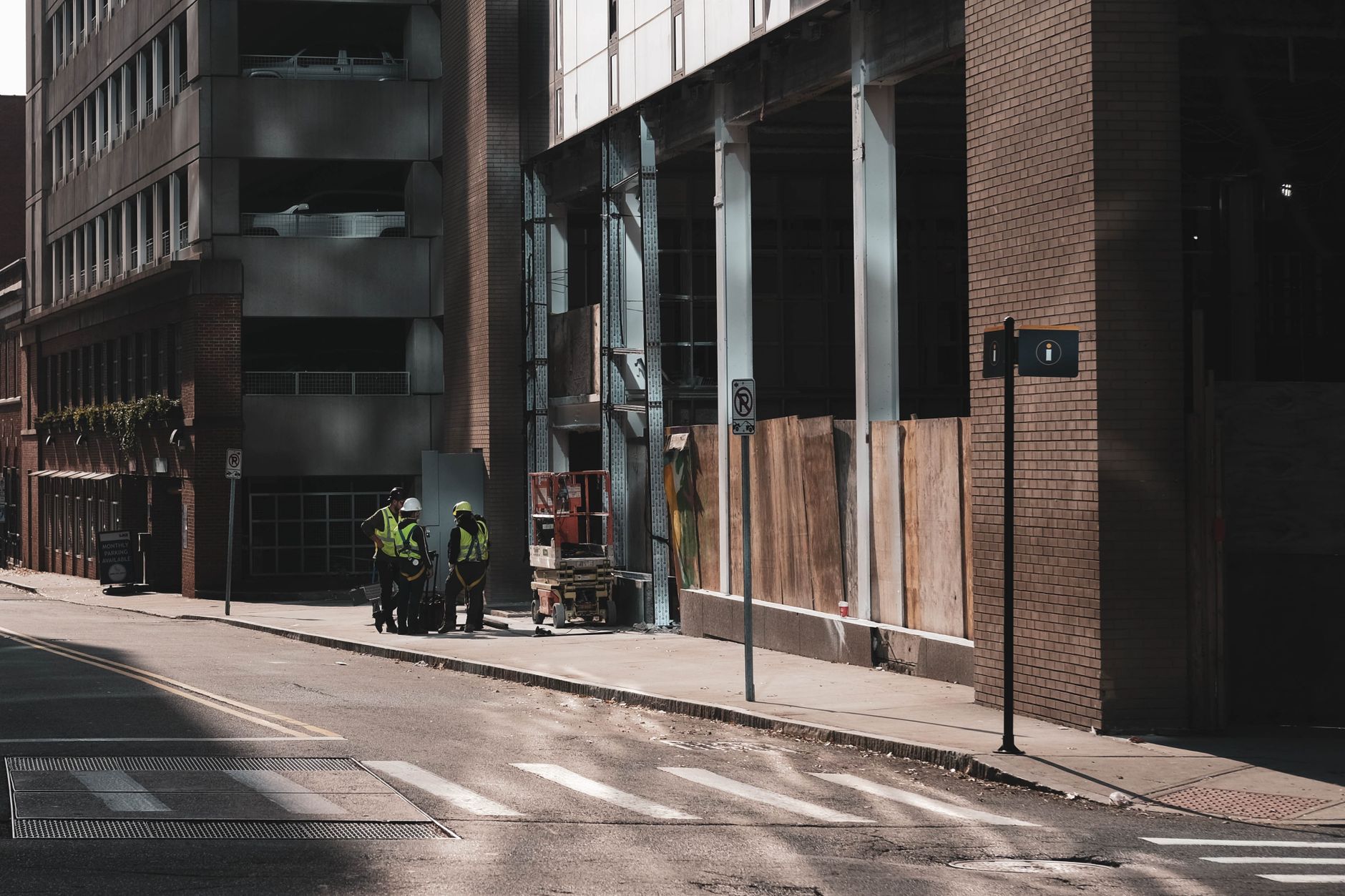 Construction crews and equipment rebuilding a downtown city street