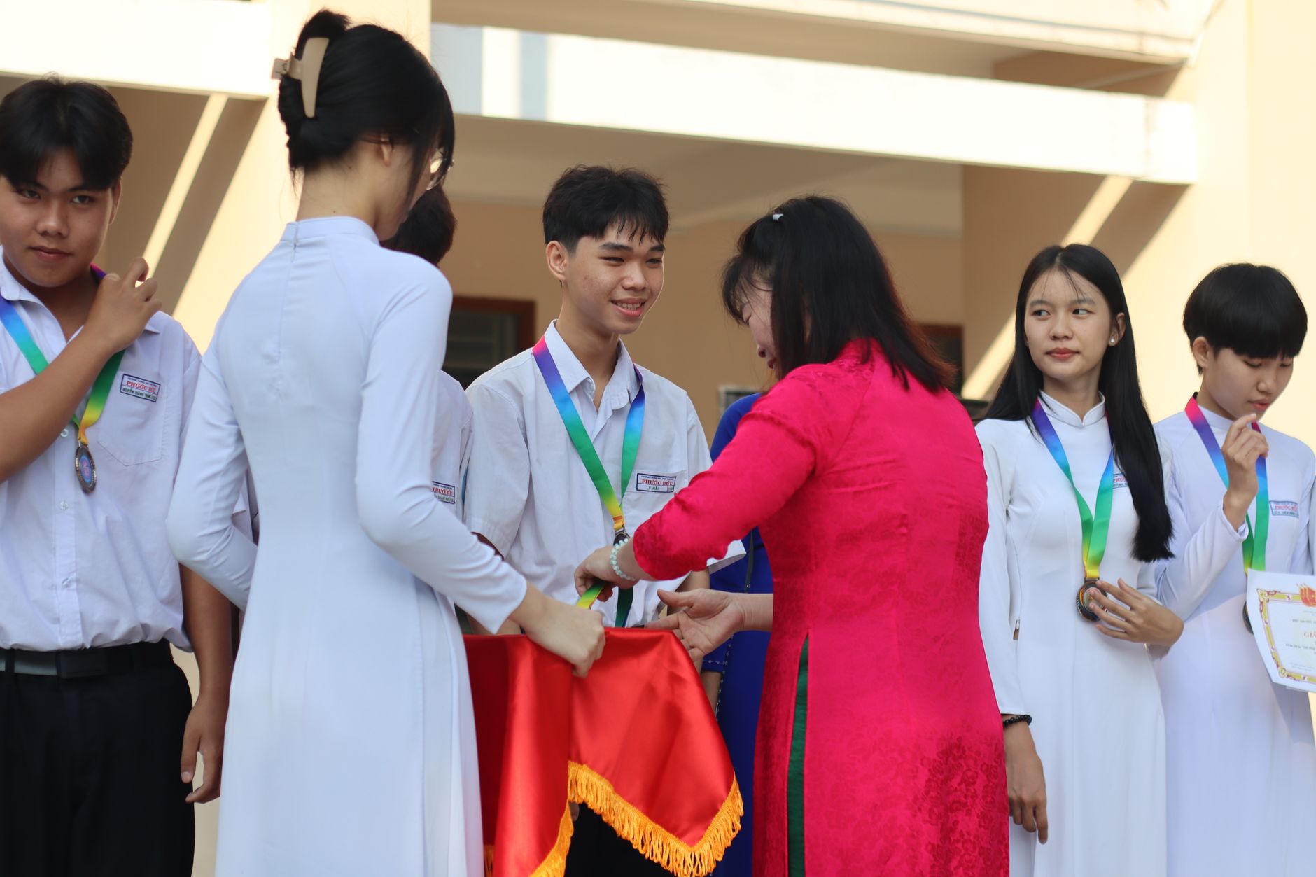 Students receiving recognition at a volunteer awards ceremony