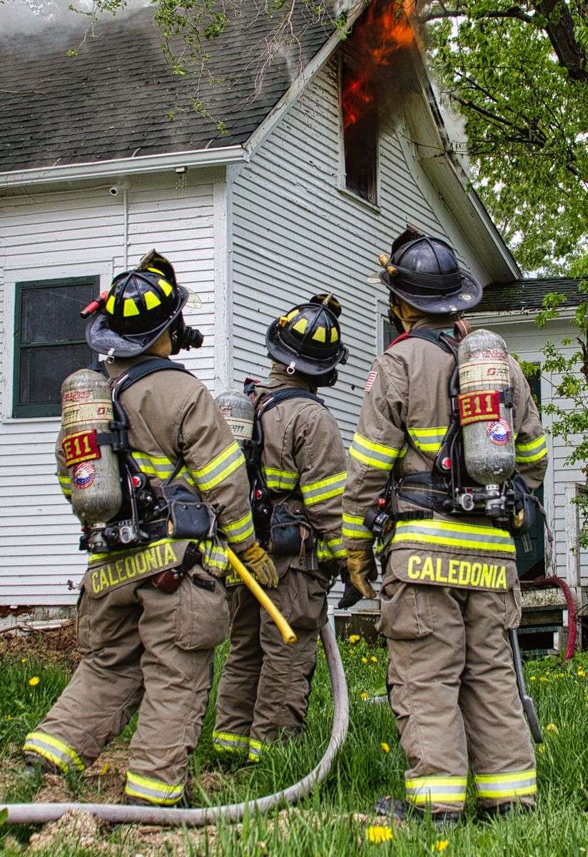 Firefighters responding to a fire scene