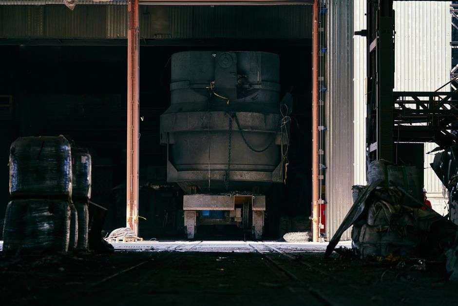 Interior of an industrial steel manufacturing facility with heavy machinery