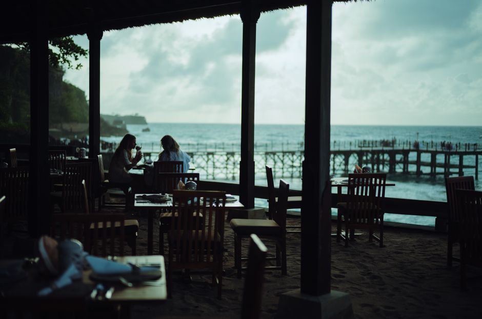 An open-air waterfront restaurant with ocean views