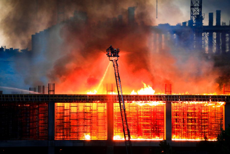 Firefighters responding to a commercial building fire