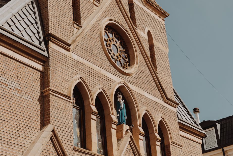A restored Gothic Revival church steeple similar to Trinity Episcopal Church in Mobile