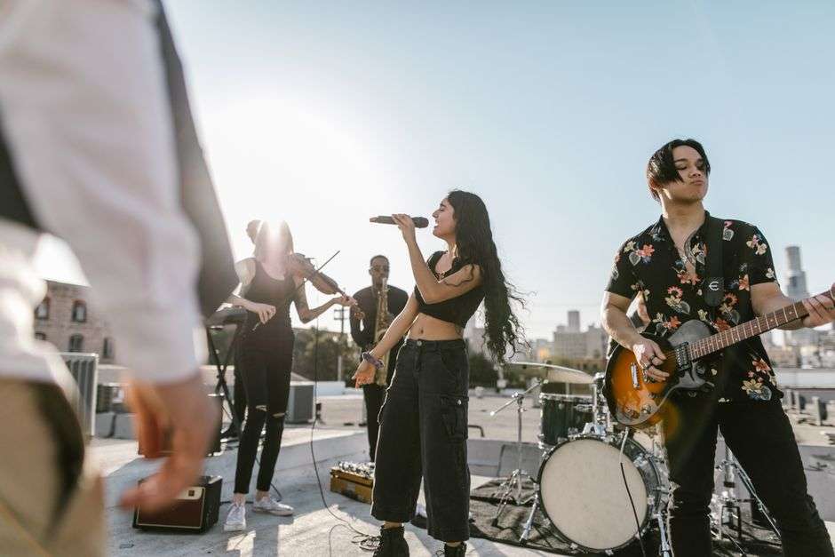 Musicians perform on an outdoor stage at a community music festival