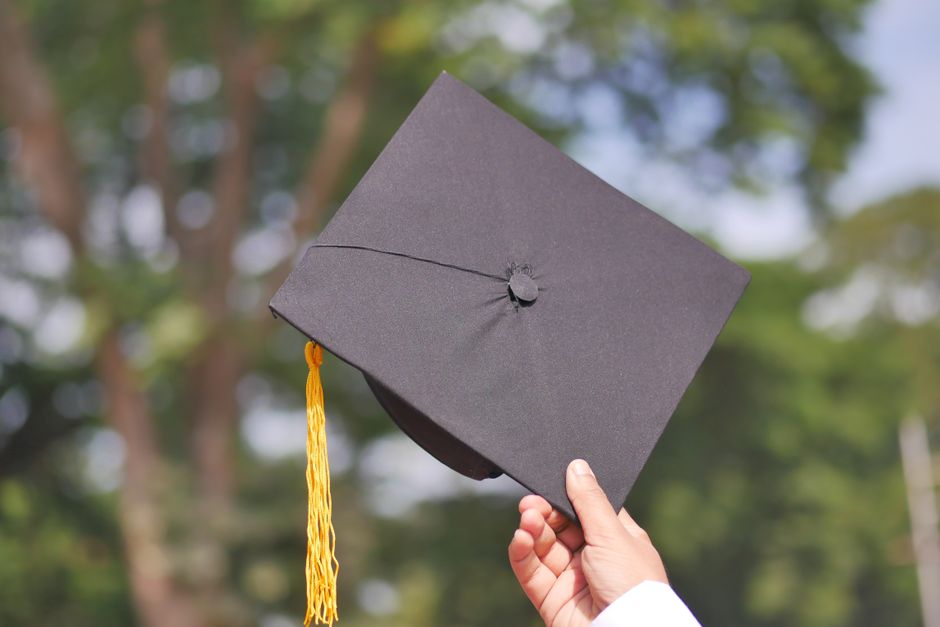 Graduates in caps and gowns at a college commencement ceremony