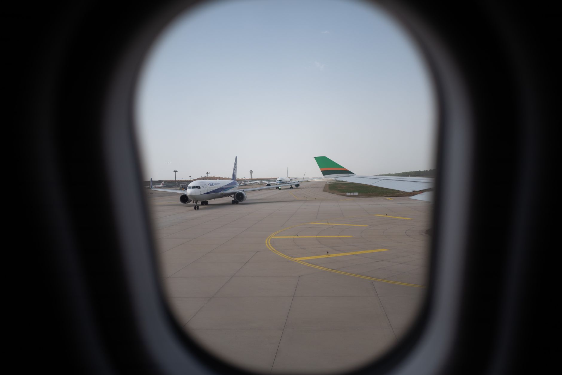A commercial passenger jet on the runway at a regional airport
